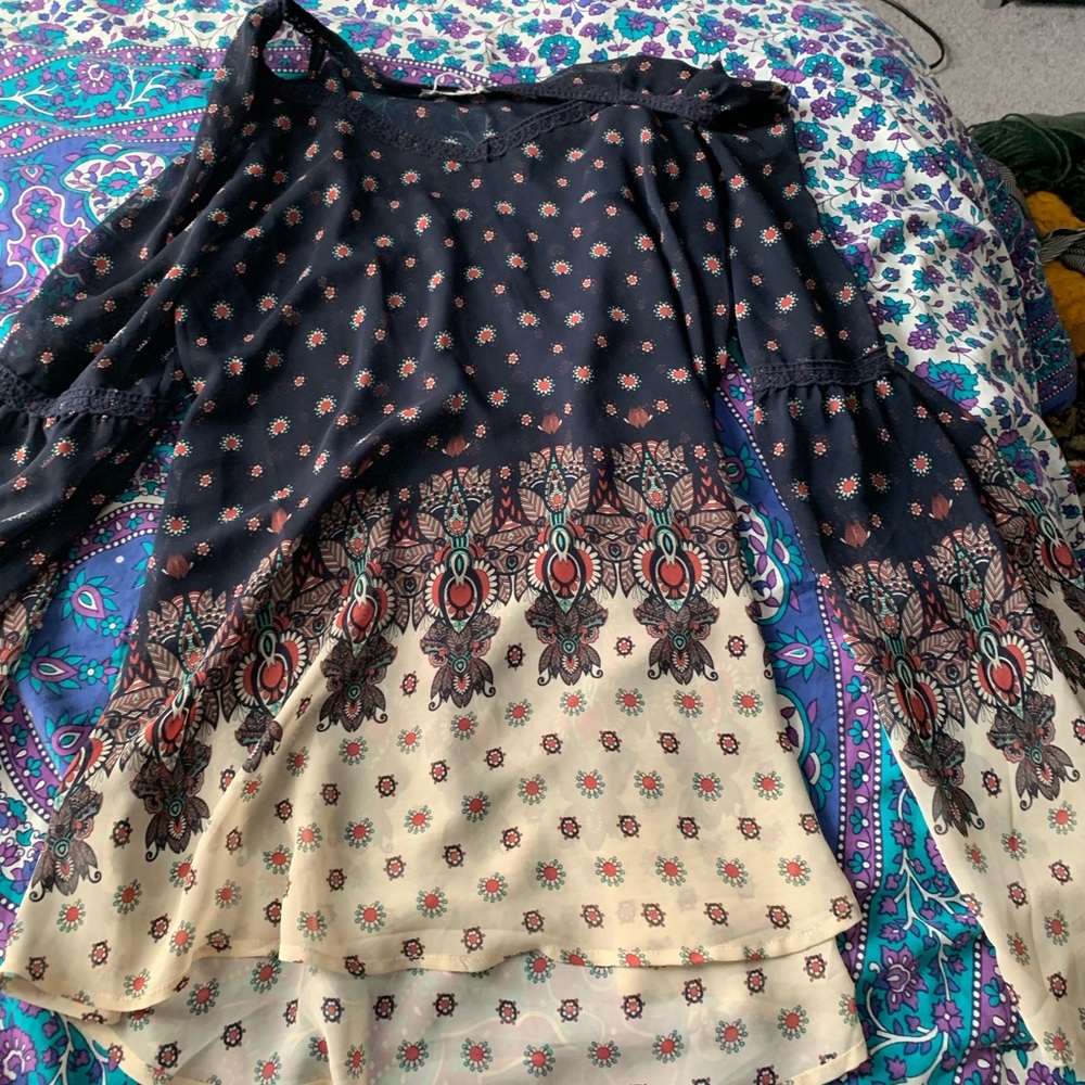 Sheer flowy navy top with print